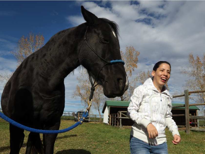 Jenny Seth, 35, feels a connection to horses, especially Diva, at Whispering Equine. Jenny suffers from hypo cephalic cyst condition which is similar to cerebral palsy. Christina Ryan, Calgary Herald.