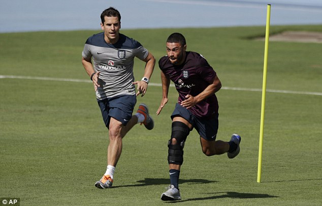 Up and running: Alex Oxlade-Chamberlain is put through his paces as England train in Rio. Daily Mail