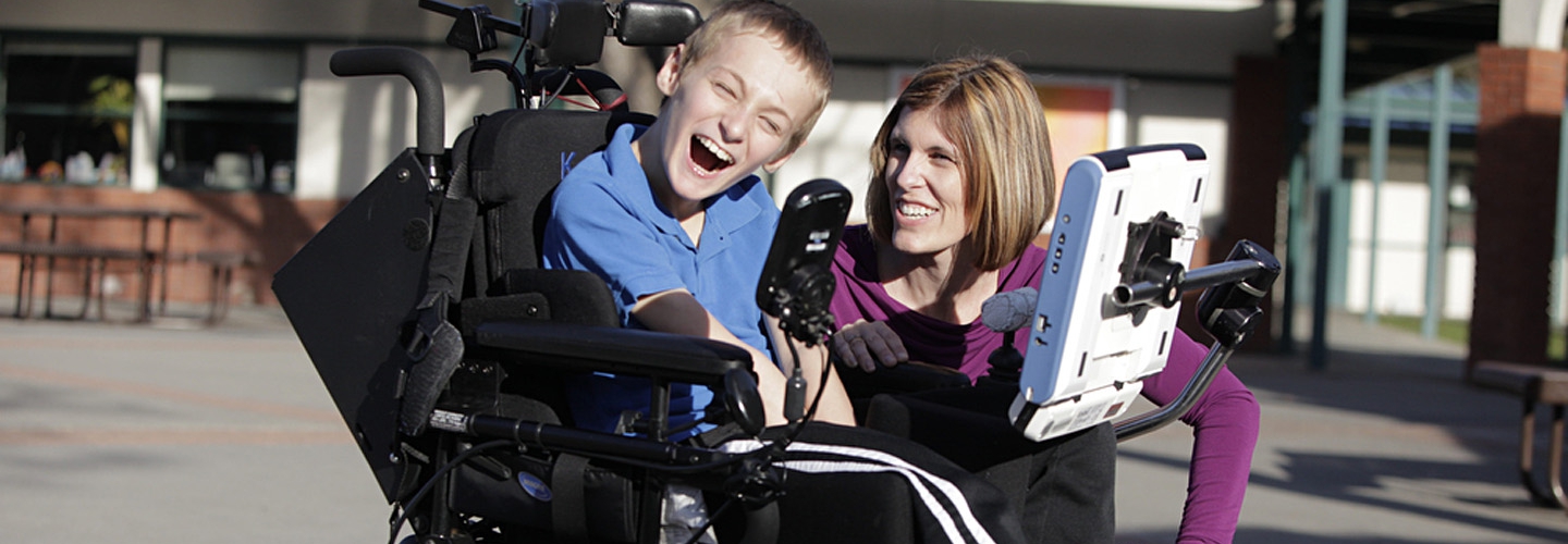 Wendy Burkhardt, seen here with student Kevin O’Brien, says the convergence of assistive technologies with consumer technologies has given her school's special education department a bigger toolbox to work with. Ed Tech